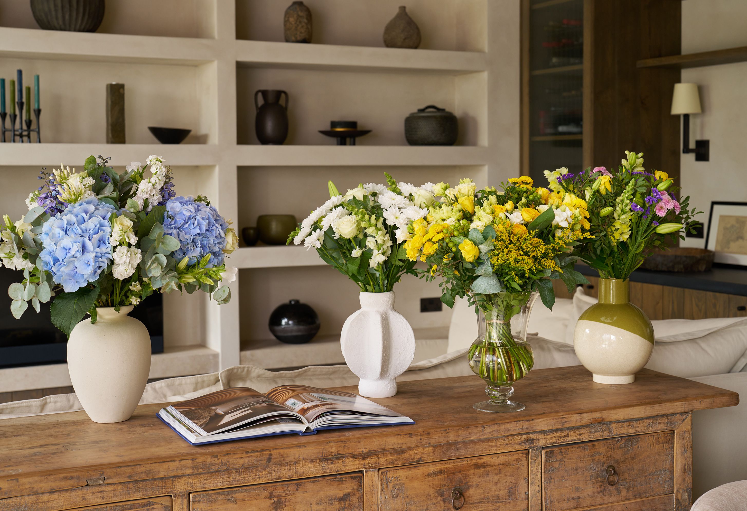 Bouquets of flowers arrange on a side table