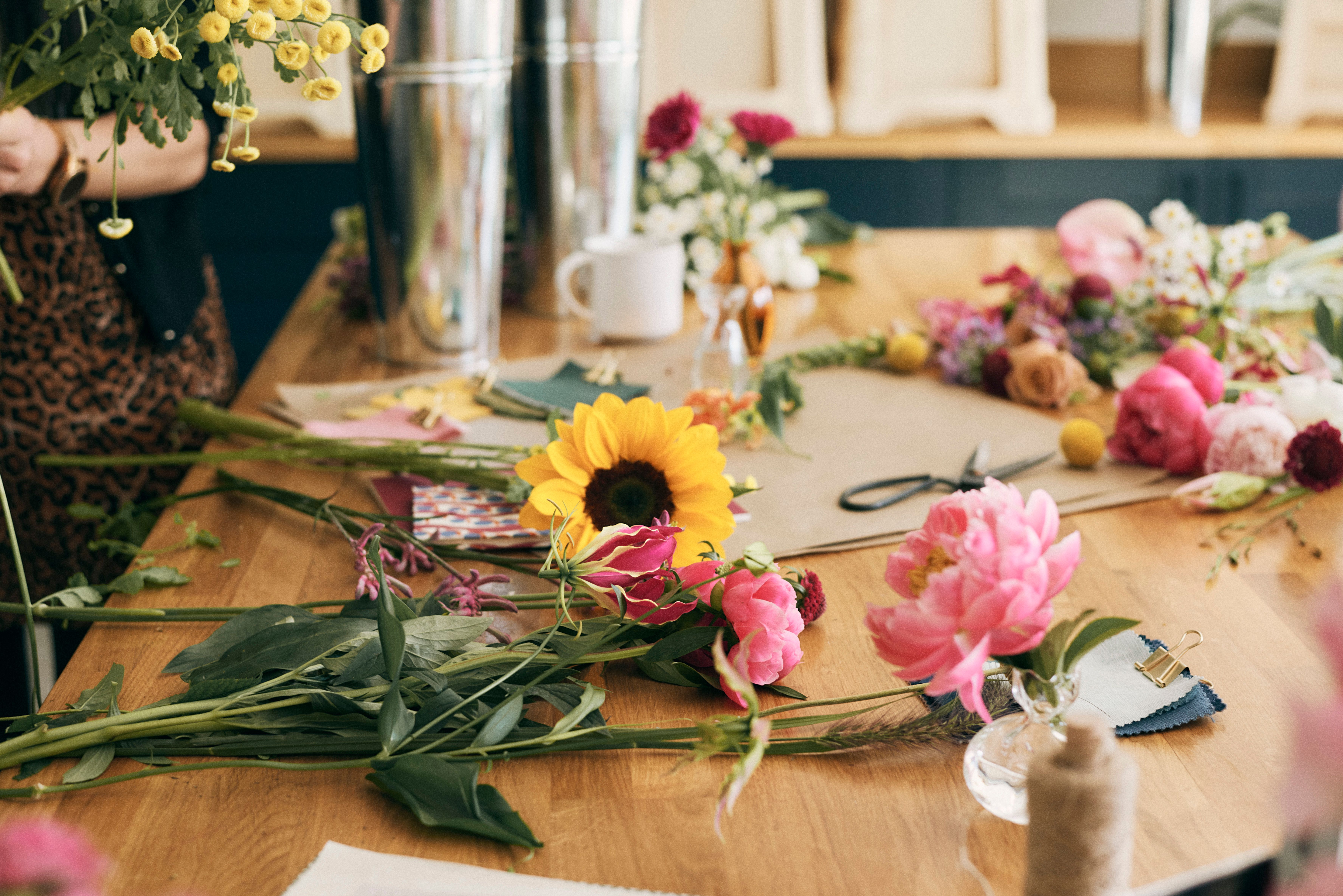 Sunflowers and peonies on a florists' table
