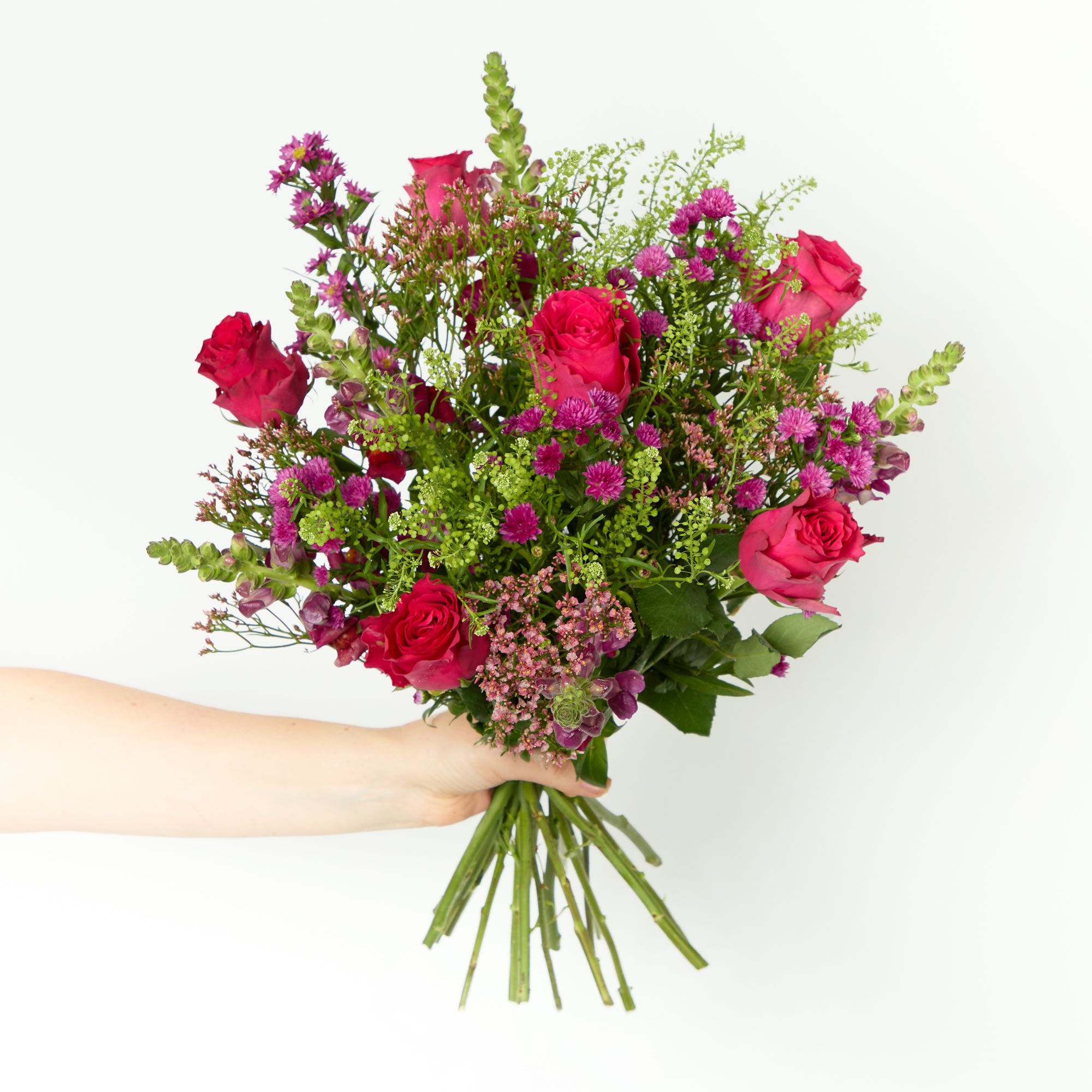 Cerise roses, red antirrhinum, 'Sin Scar Diamond' limonium, cerise asters and greenbell