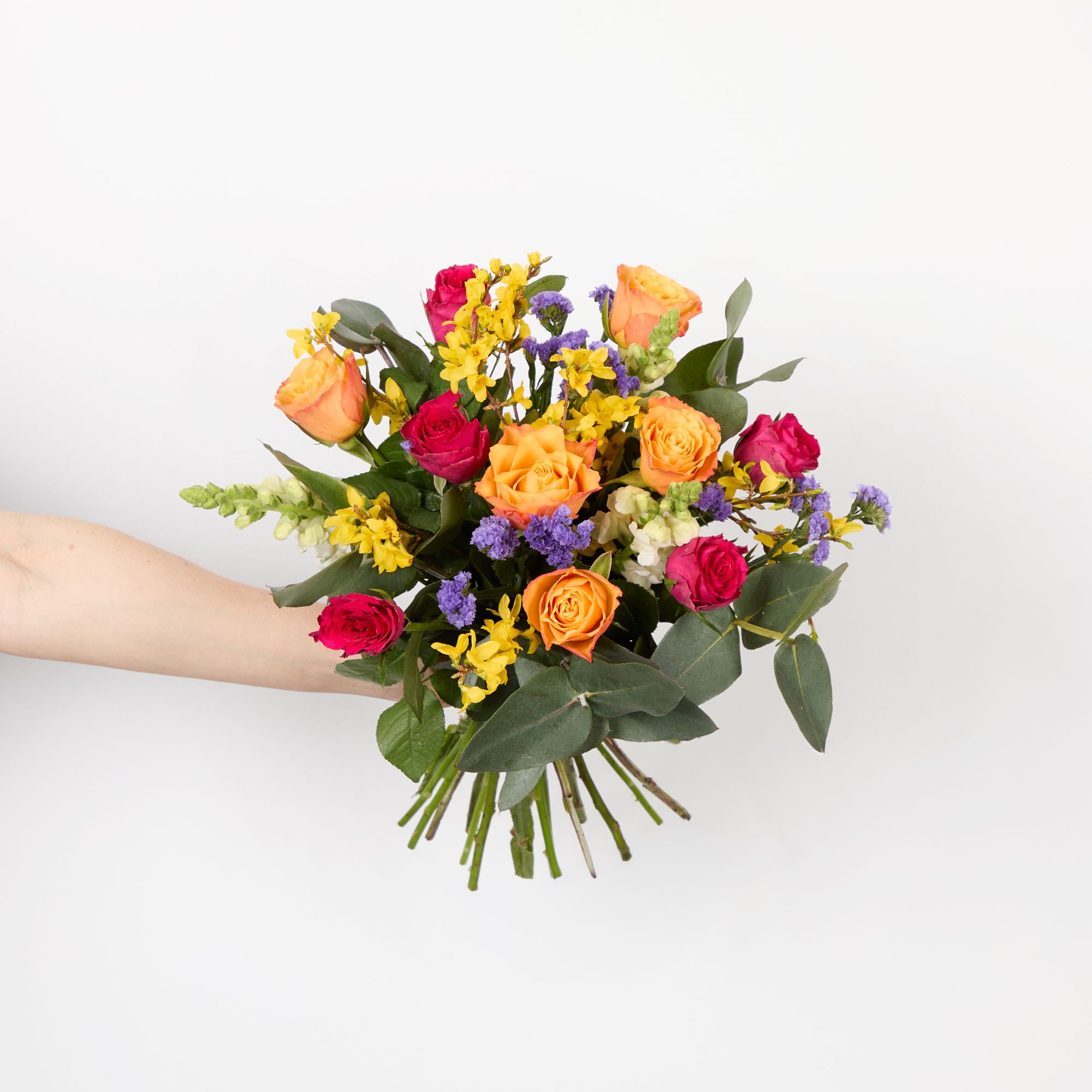 Orange roses, forsythia, white antirrhinums, cerise roses, purple statice and eucalyptus robusta