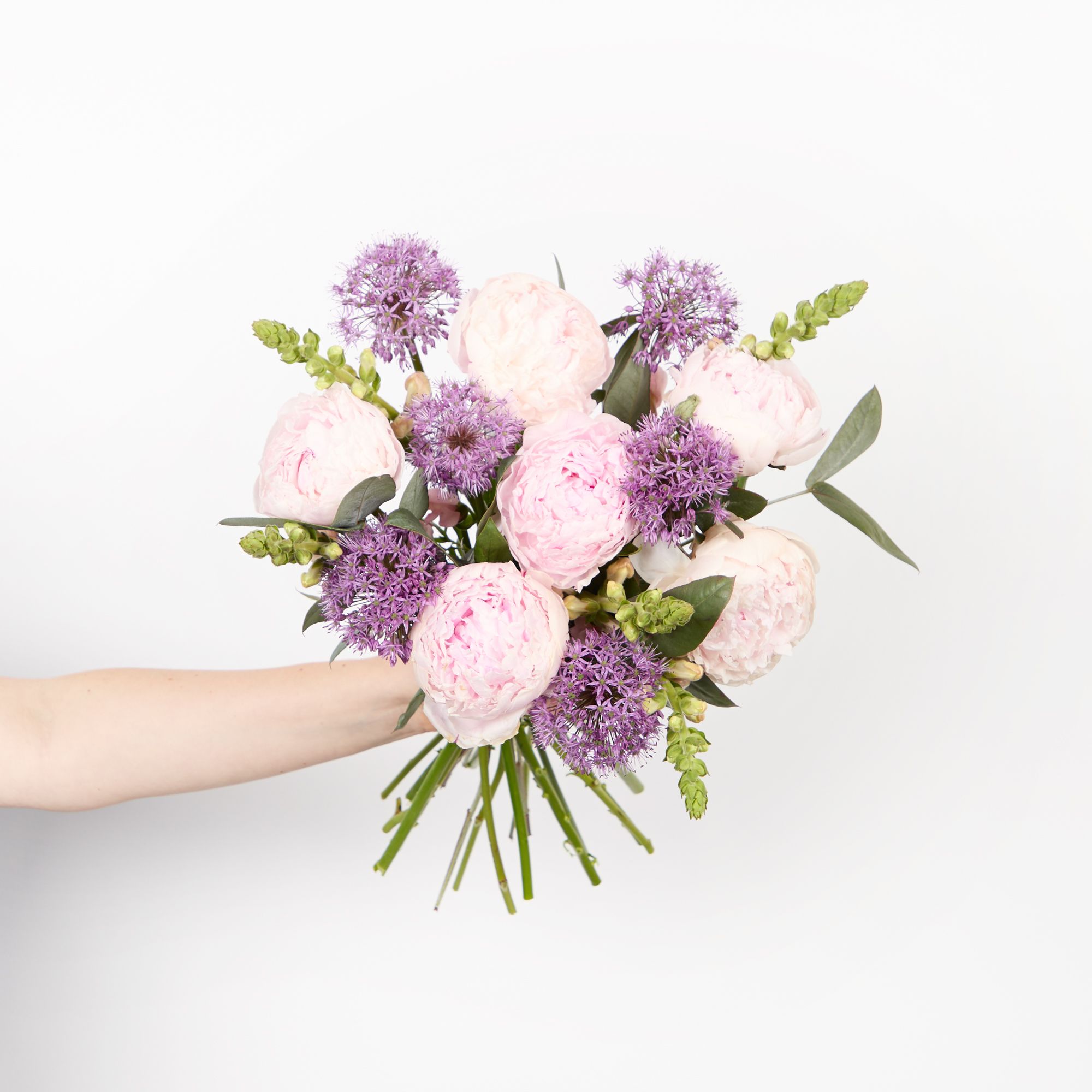 Pink peonies, alliums, pink antirrhinums and eucalyptus robusta