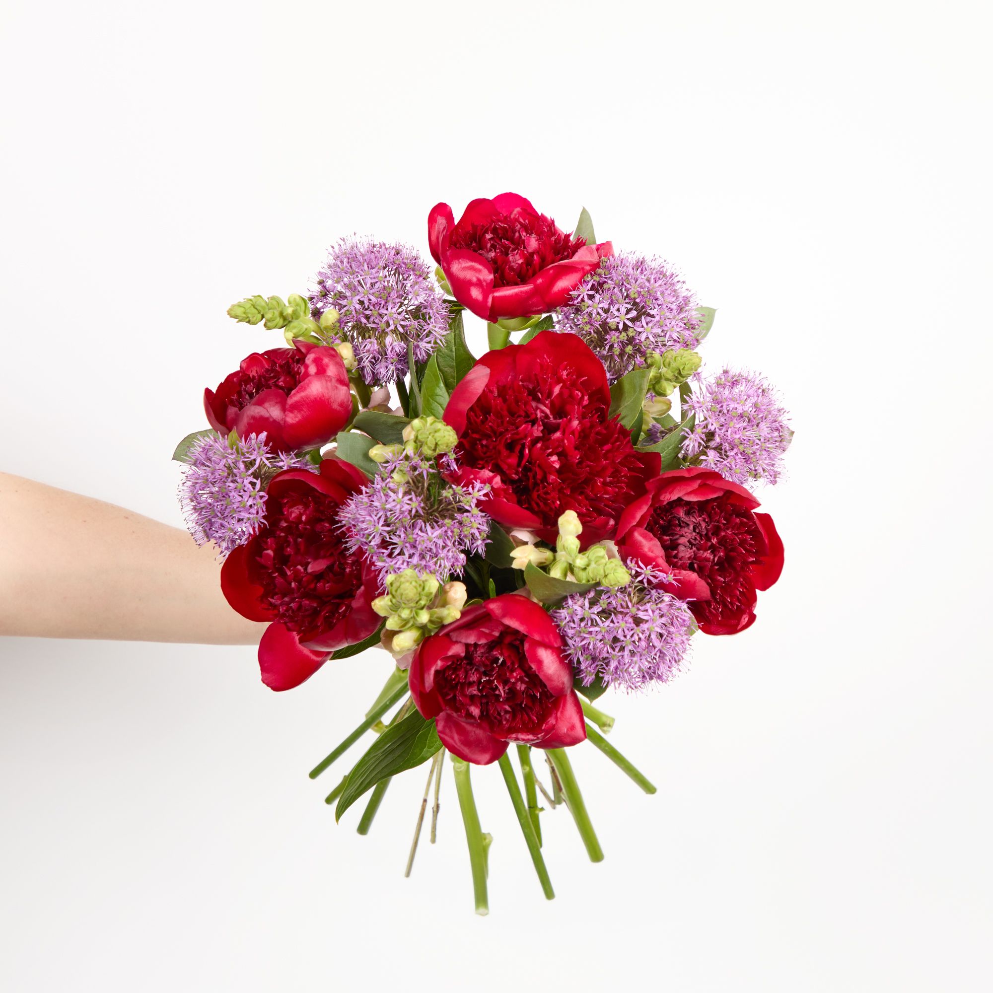 'Red Charm' peonies, purple alliums, pink antirrhinums and eucalyptus robusta