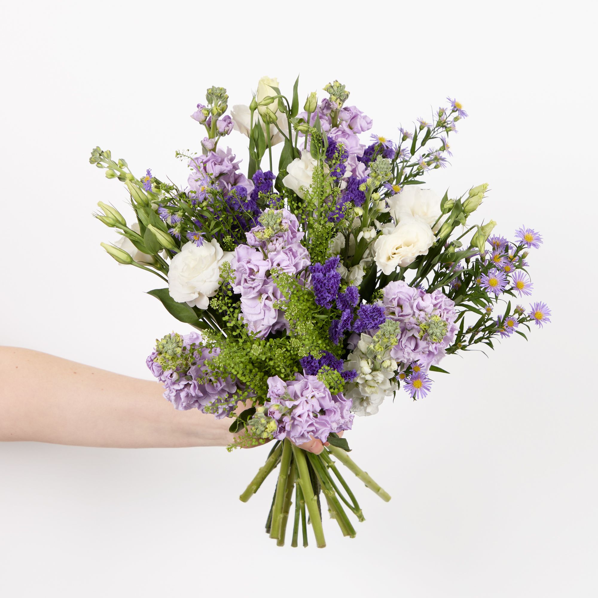 Lilac stocks, white stocks, purple asters, purple statice, white lisianthus and greenbell