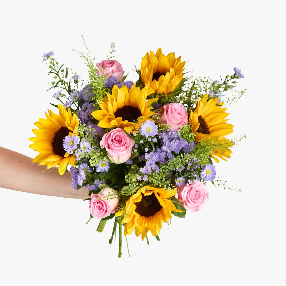 Sunflowers, lilac asters, pink roses, lilac statice and greenbell