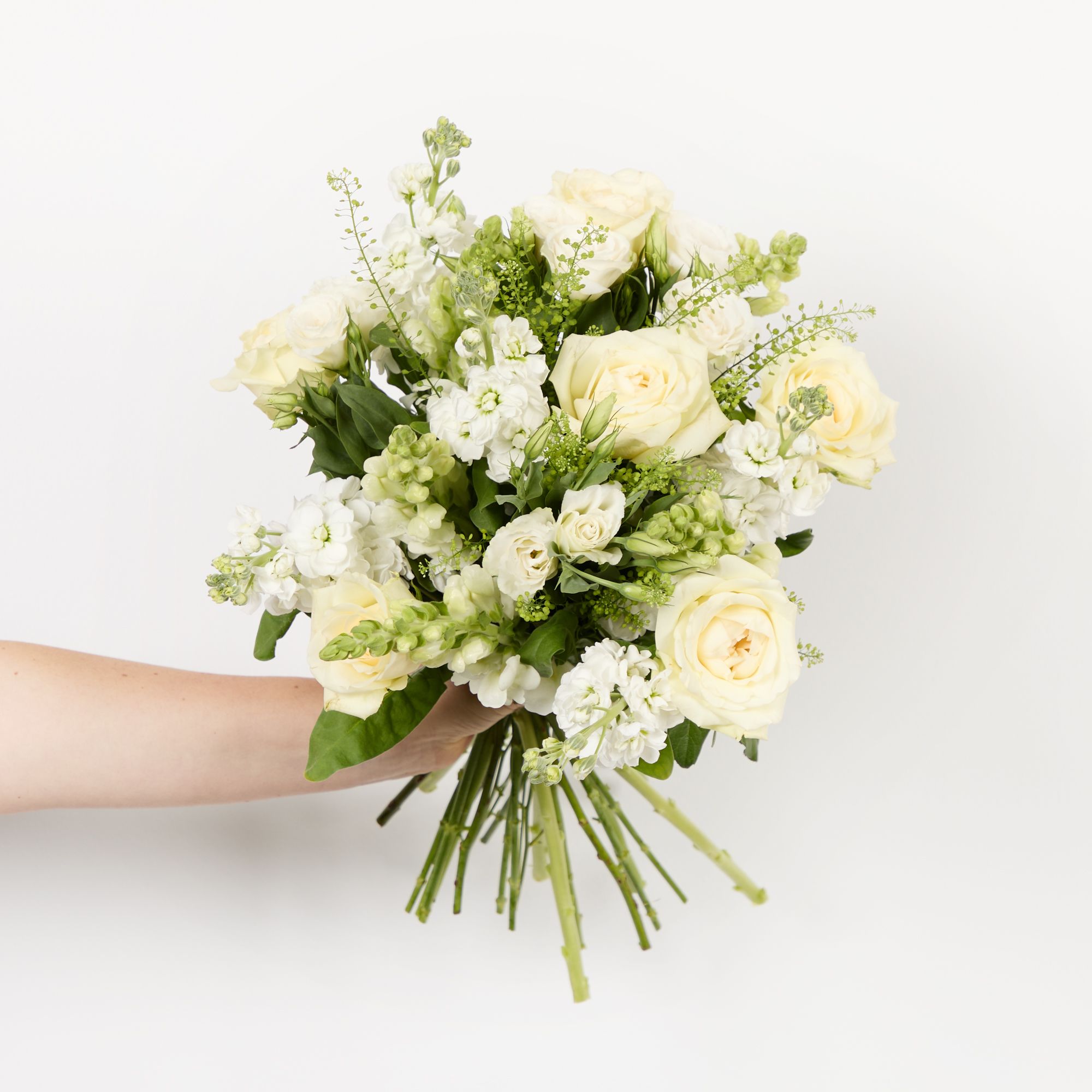 White roses, lisianthus, stocks, antirrhinums and greenbell