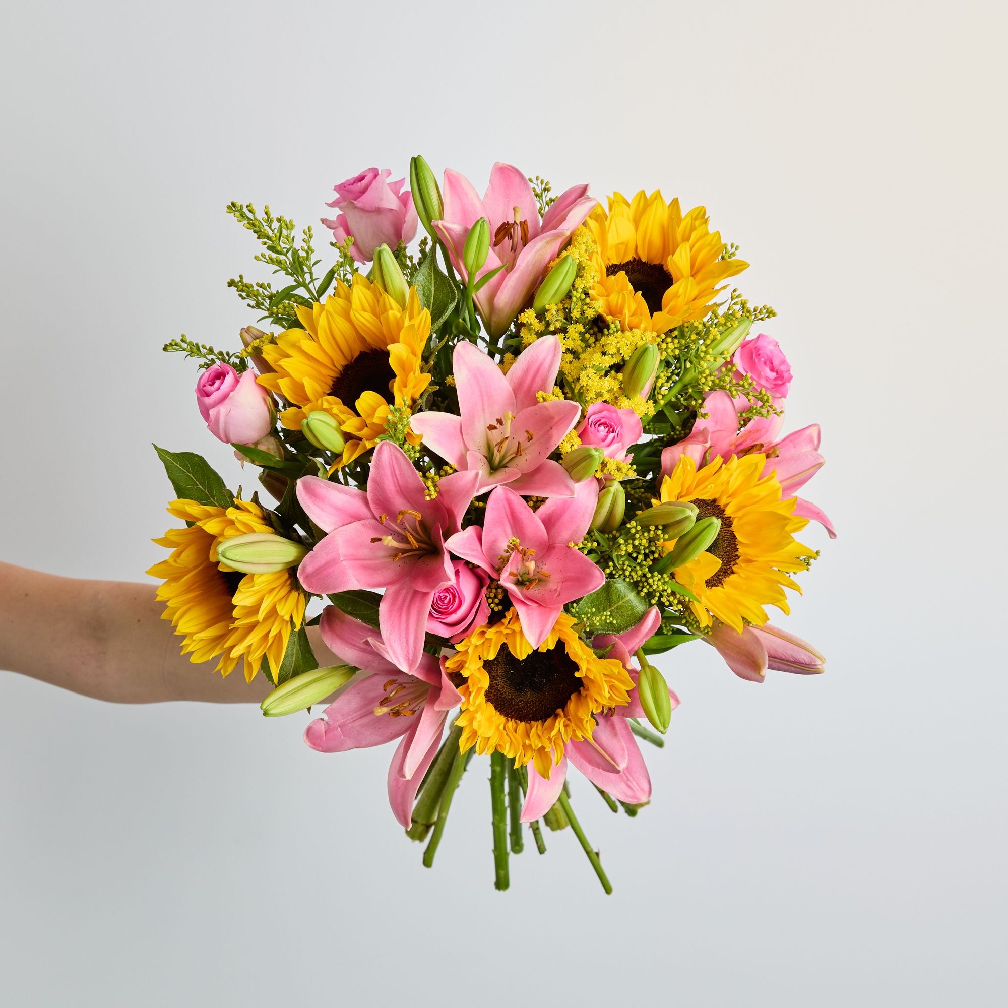 UK-grown sunflowers, pink lilies, pink roses and UK-grown solidago