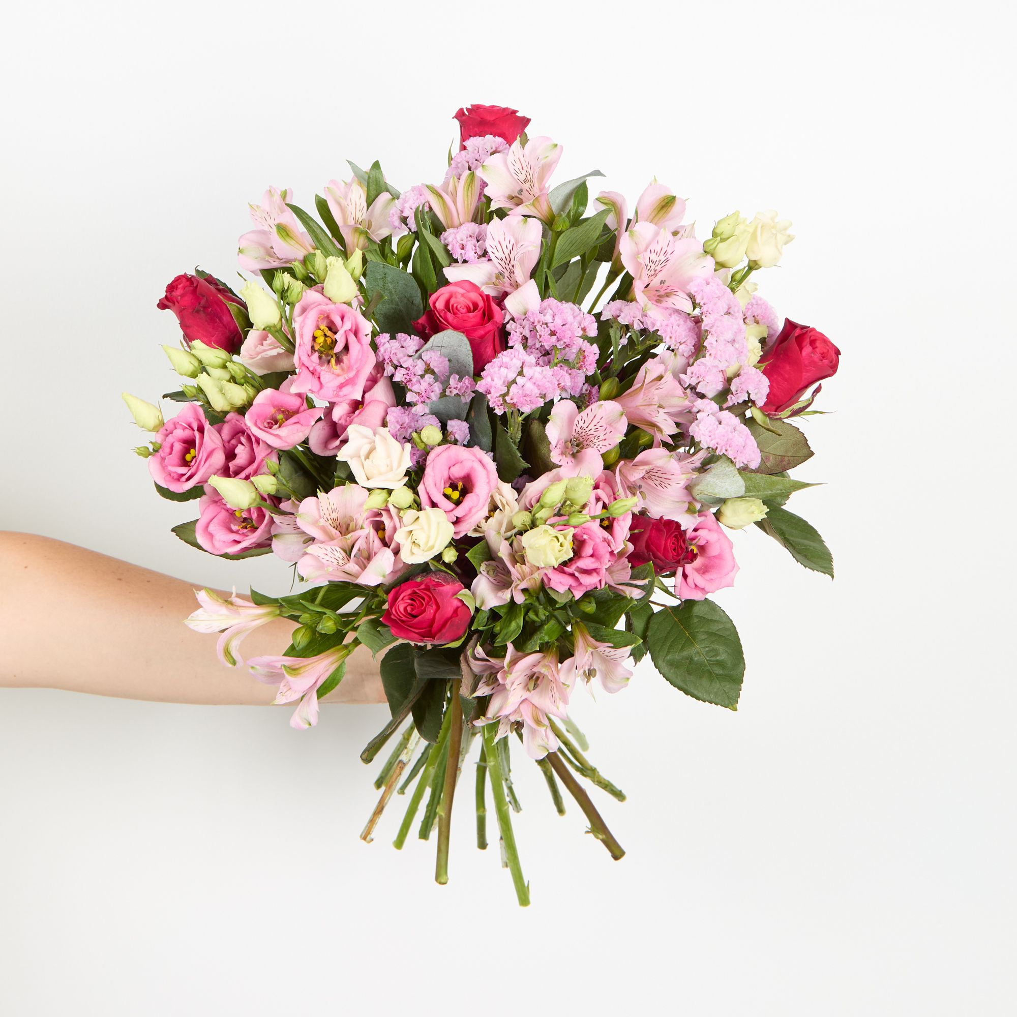 Pink alstroemeria, cerise roses, pink statice, pink lisianthus and eucalyptus robusta