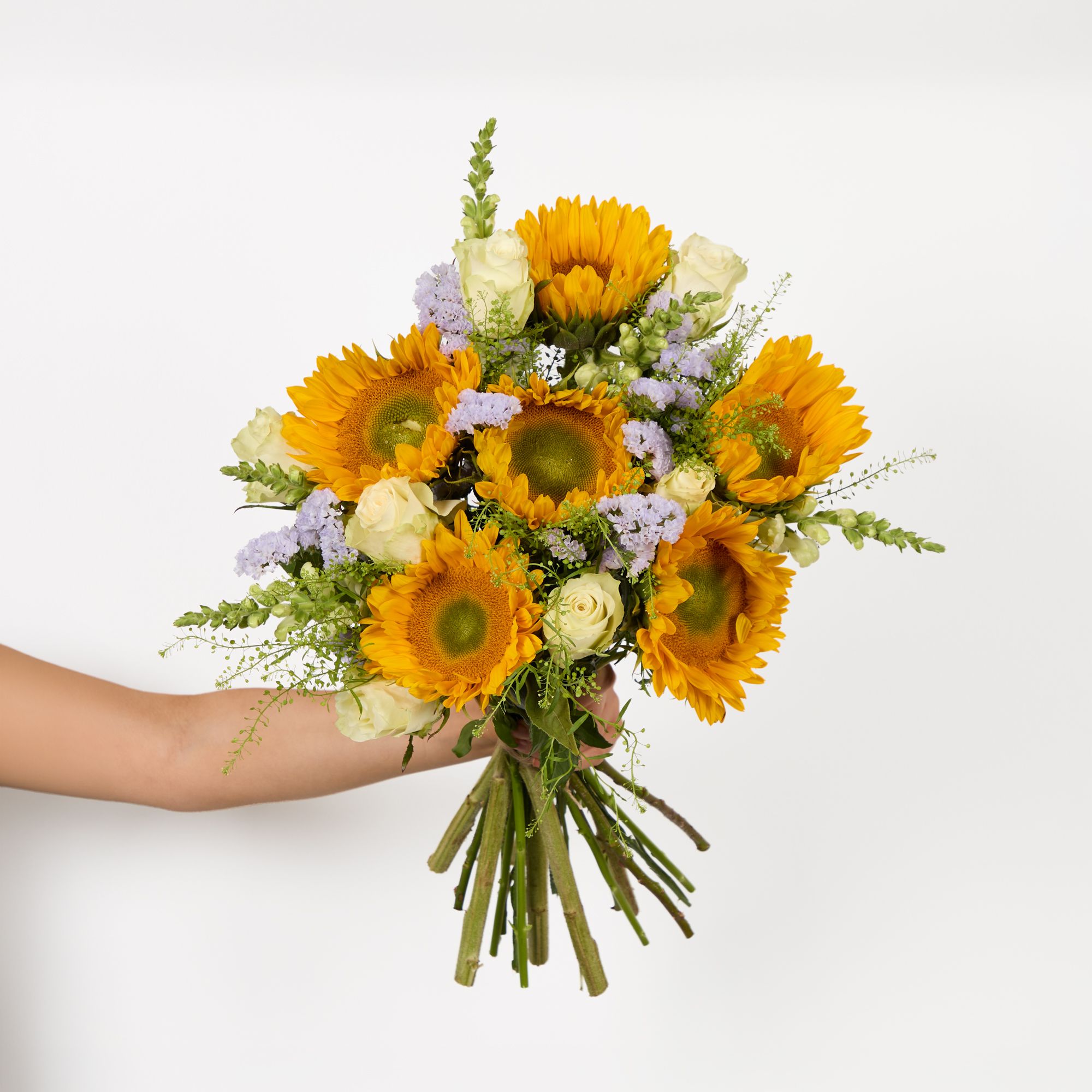 Sunflowers, white roses, white antirrhinums, lilac statice and greenbell
