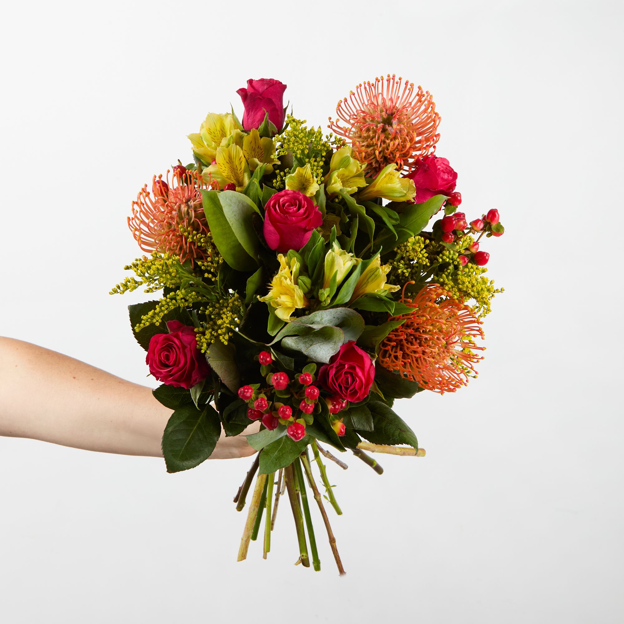 Orange nutans, cerise roses, yellow alstroemeria, red hypericum, solidago and eucalyptus robusta