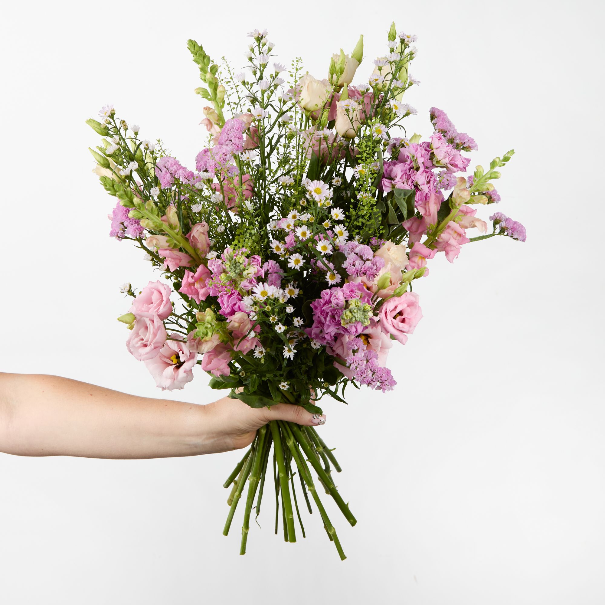 Pink stocks, asters, statice, antirrhinums, lisianthus and greenbell