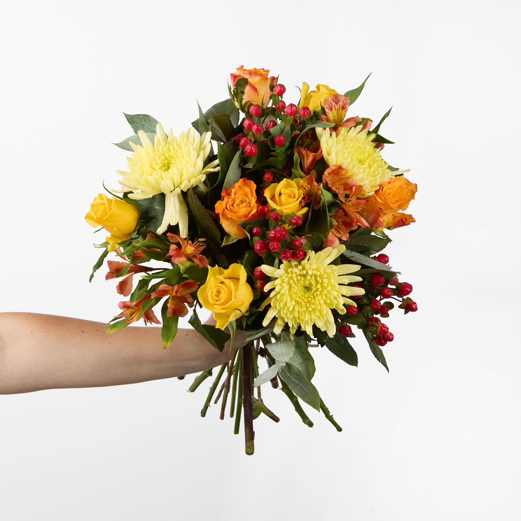 Yellow 'Bloom Topspin' chrysanthemums, yellow roses, orange roses, orange alstroemeria, red hypericum and eucalyptus robusta
