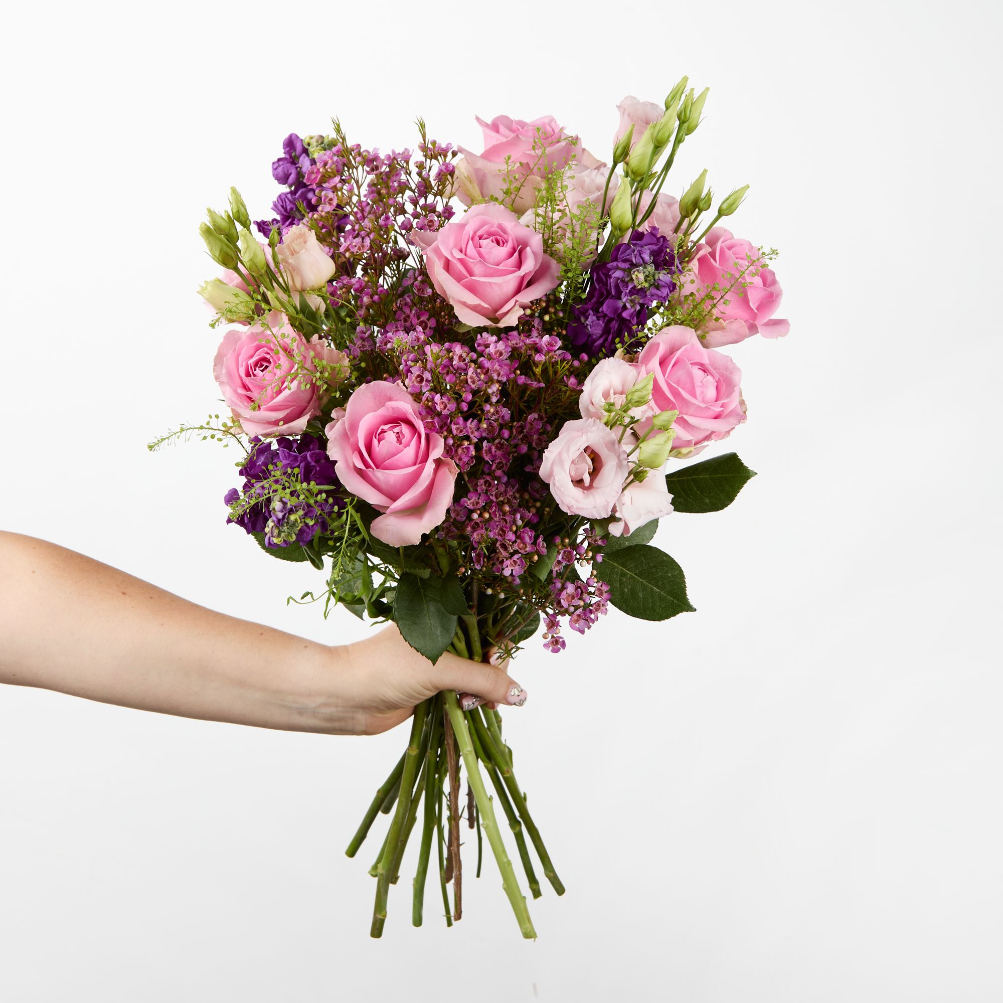 Pink roses, pink lisianthus, purple stocks, pink waxflowesrs and greenbell