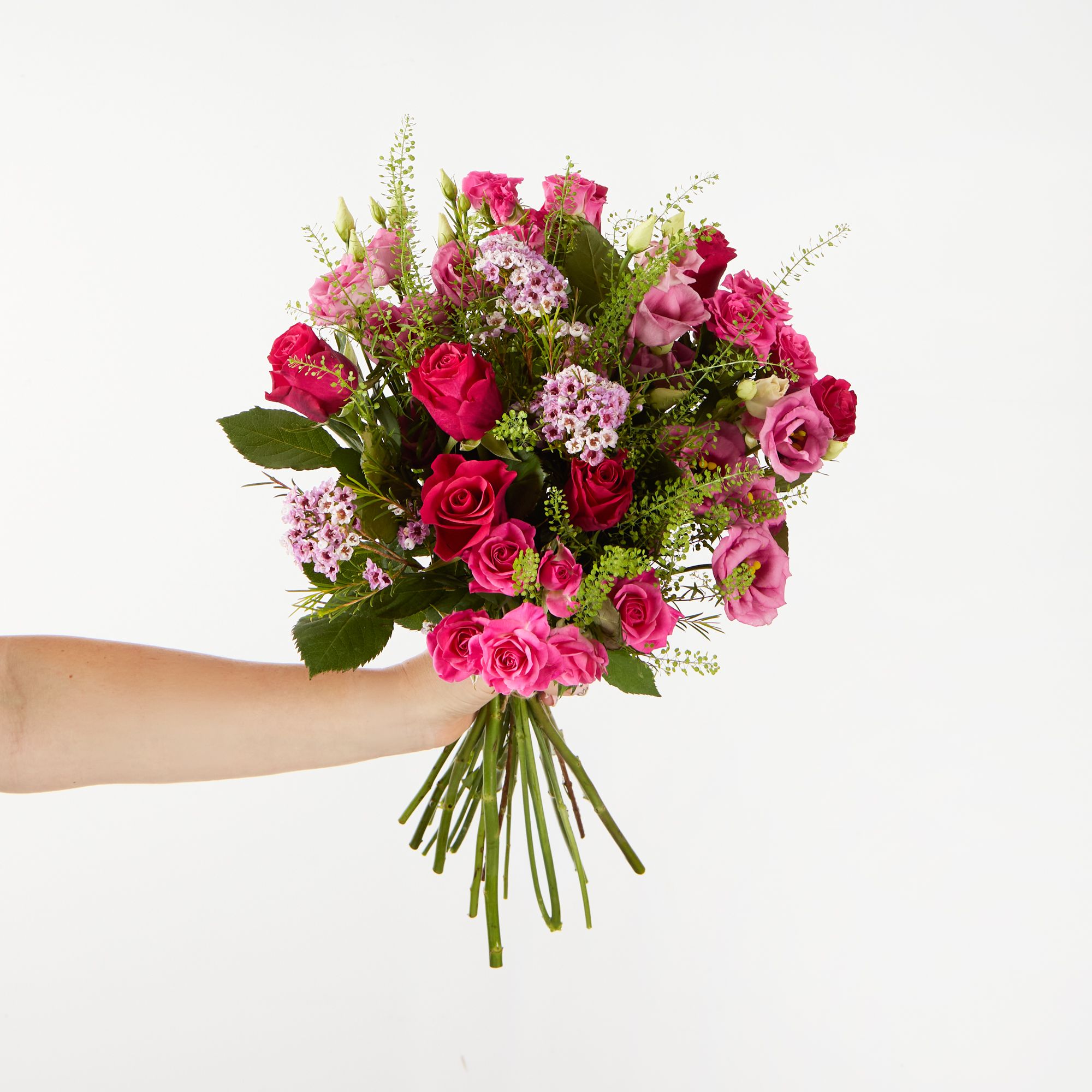 Pink roses, pink spray roses, pink lisianthus, pink waxflowers and greenbell