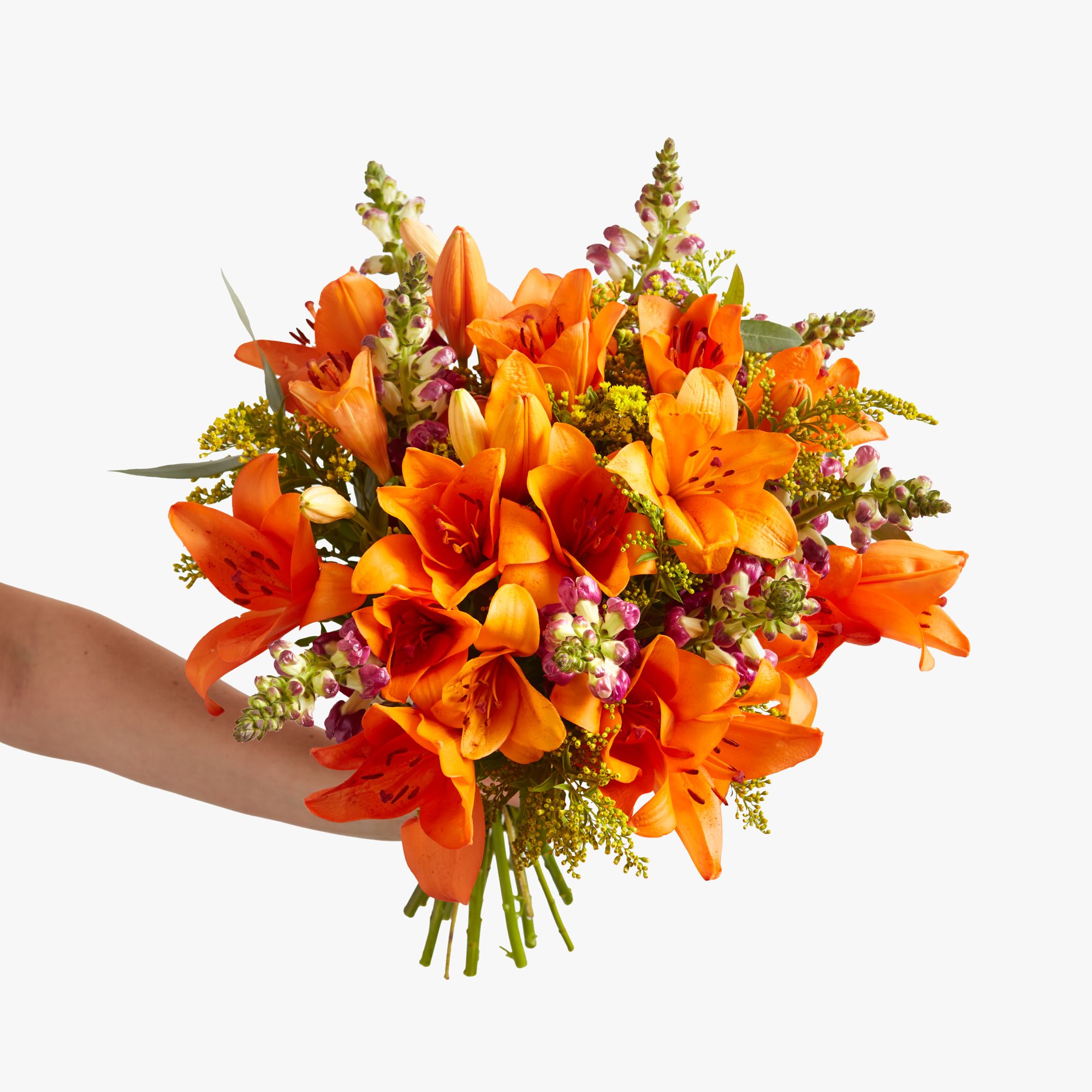 Orange 'LA' lilies, solidago, antirrhinum and eucalyptus robusta