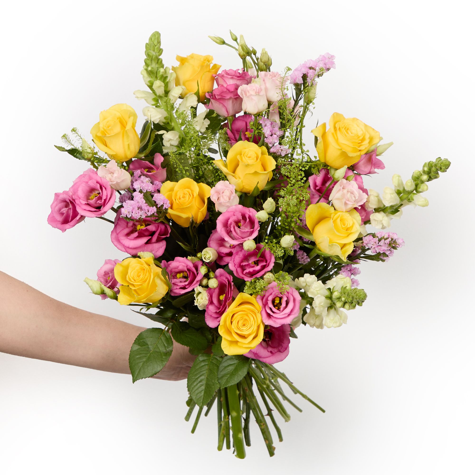 Yellow roses, pink lisianthus, white antirrhinum, pink statice and greenbell